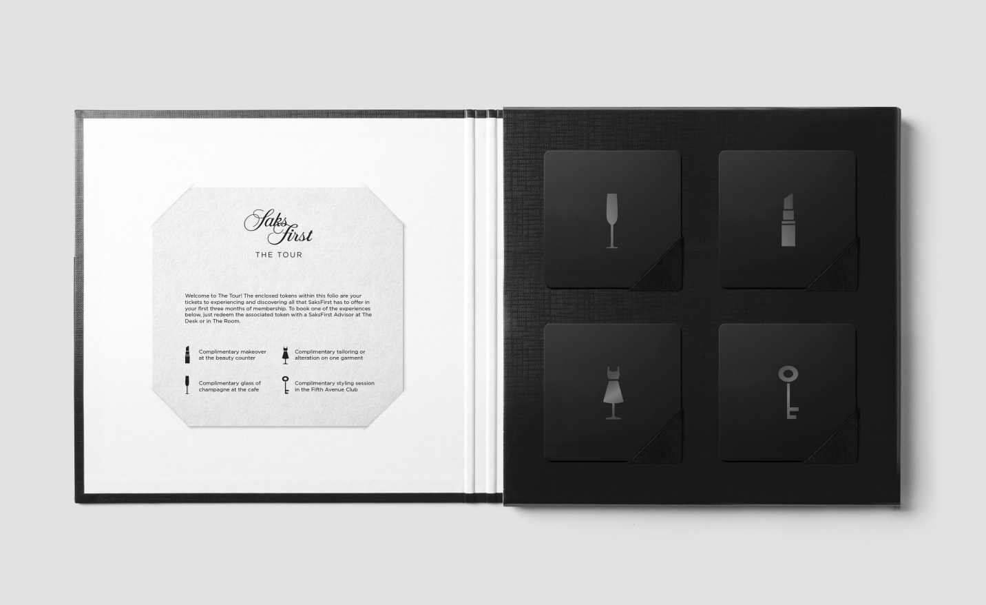 SaksFirst The Tour welcome folio with complimentary experience tokens